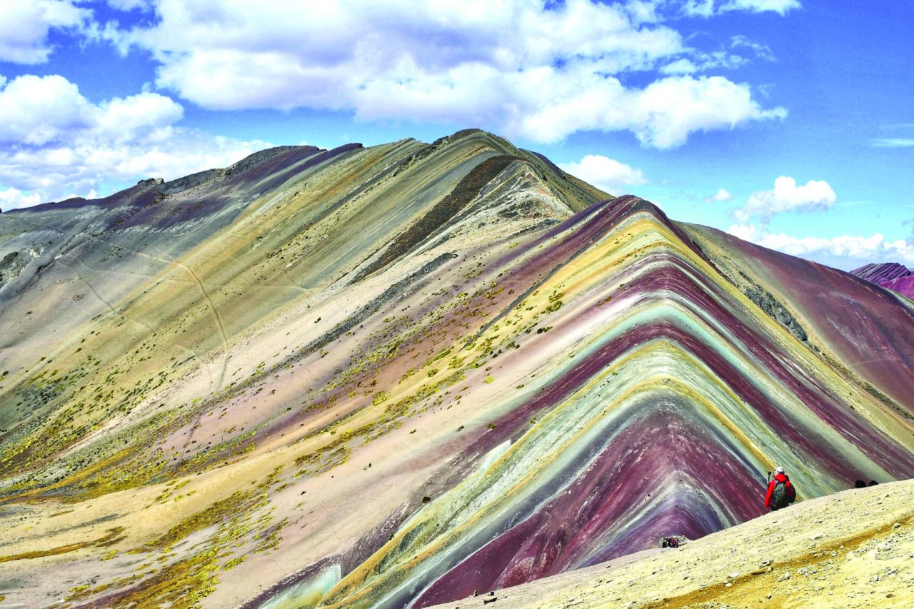 A vertical shot of the famous Rainbow Mountain in Uchullujllo, Peru during the daytime